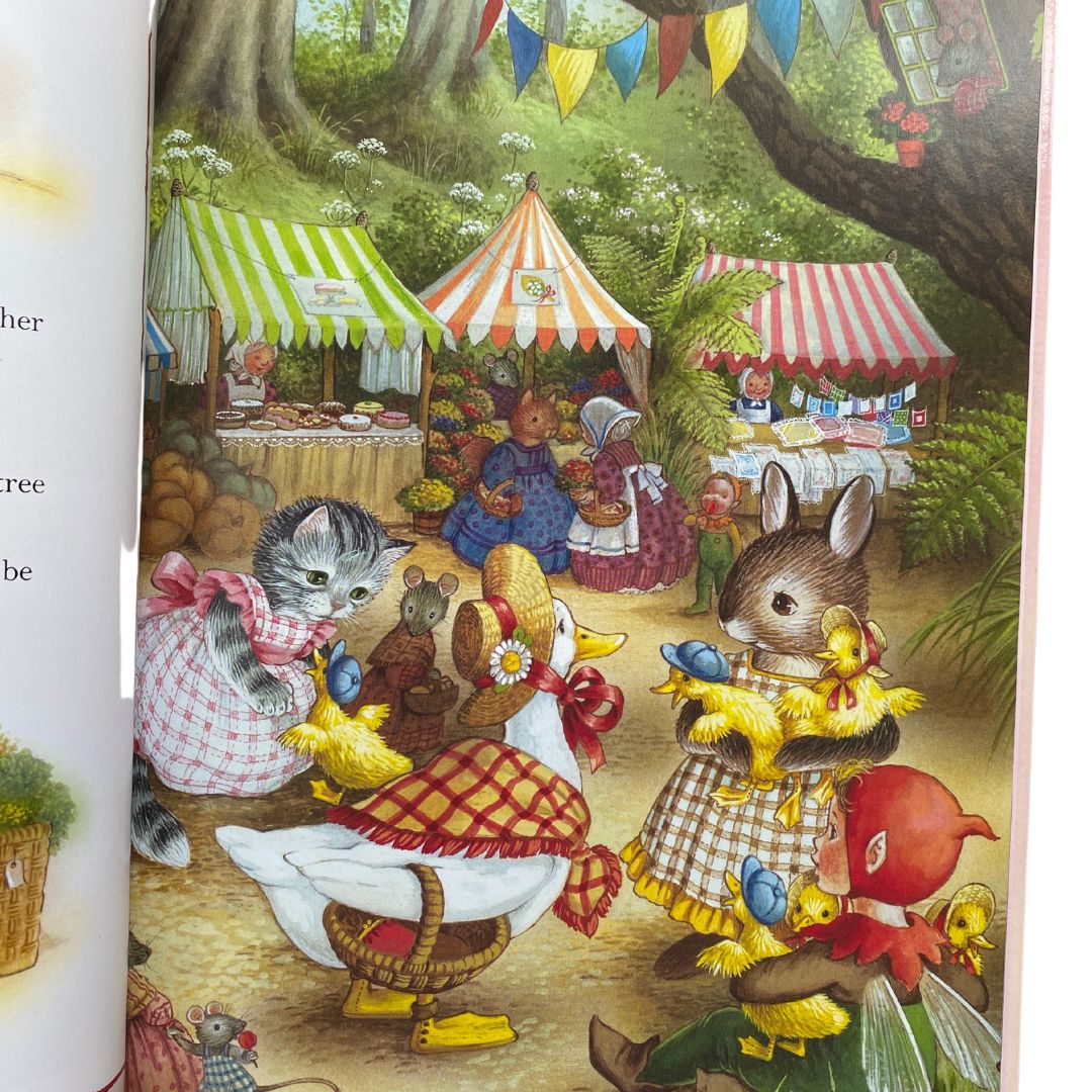 Martha rabbit and tabitha cat are helping daphne the forgetful duck iwth her ducklings on market day in the forest. There are stalls with cakes and flowers and mice, elves and other woodland creatures are shopping